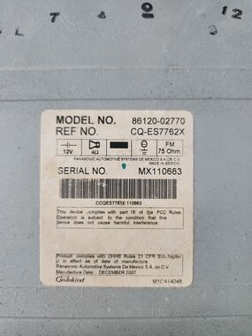 Panasonic Car Stereo Unit in Light Gray and White Label